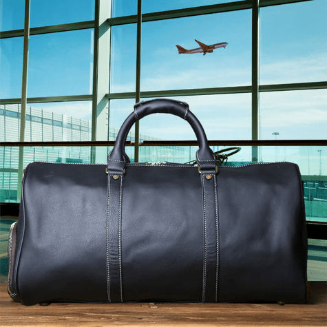 Duffle Bag Heritage - Williams Brothers
Side view of a black leather duffle style travel bag, highlighting its versatile hand strap, on an airport terminal background.
https://williamsbrothers.com.au