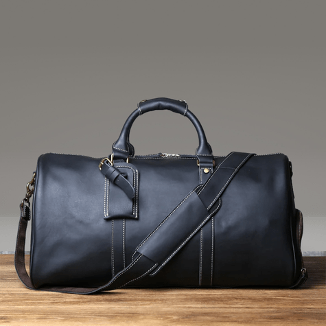 Duffle Bag Heritage - Williams Brothers
Side view of a black leather duffle style travel bag, highlighting its versatile hand and shoulder strap, on a wood floor and a grey background.
https://williamsbrothers.com.au