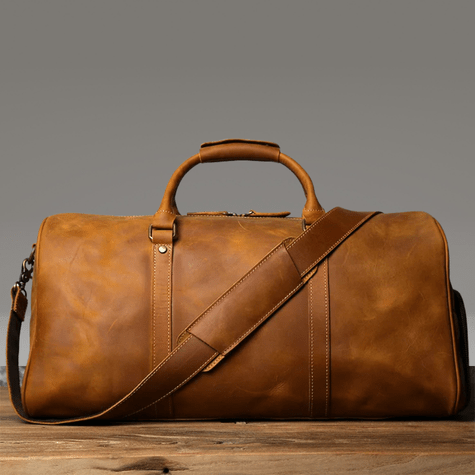Duffle Bag Heritage - Williams Brothers
Side view of a light brown leather duffle style travel bag, highlighting its versatile hand and shoulder strap, on a wood floor and a grey background.
https://williamsbrothers.com.au