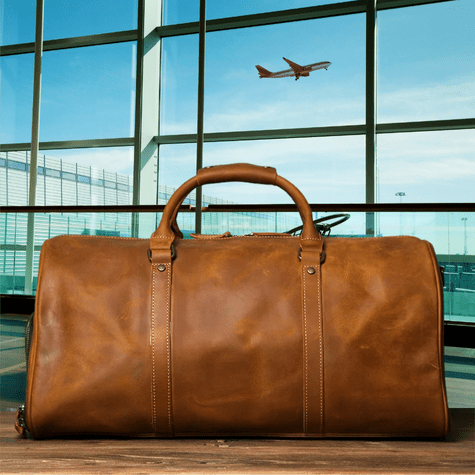 Duffle Bag Heritage - Williams Brothers
Side view of a brown leather duffle style travel bag, highlighting its versatile hand strap, on an airport terminal background.
https://williamsbrothers.com.au