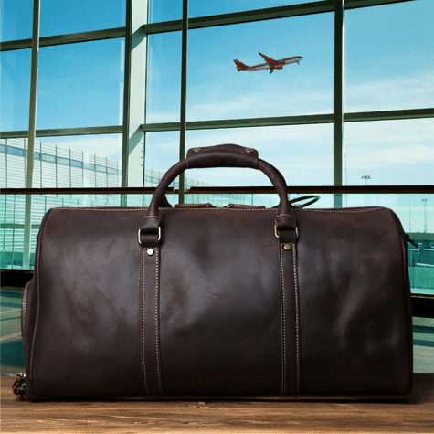 Duffle Bag Heritage - Williams Brothers
Side view of a dark brown leather duffle style travel bag, highlighting its versatile hand strap, on an airport terminal background.
https://williamsbrothers.com.au